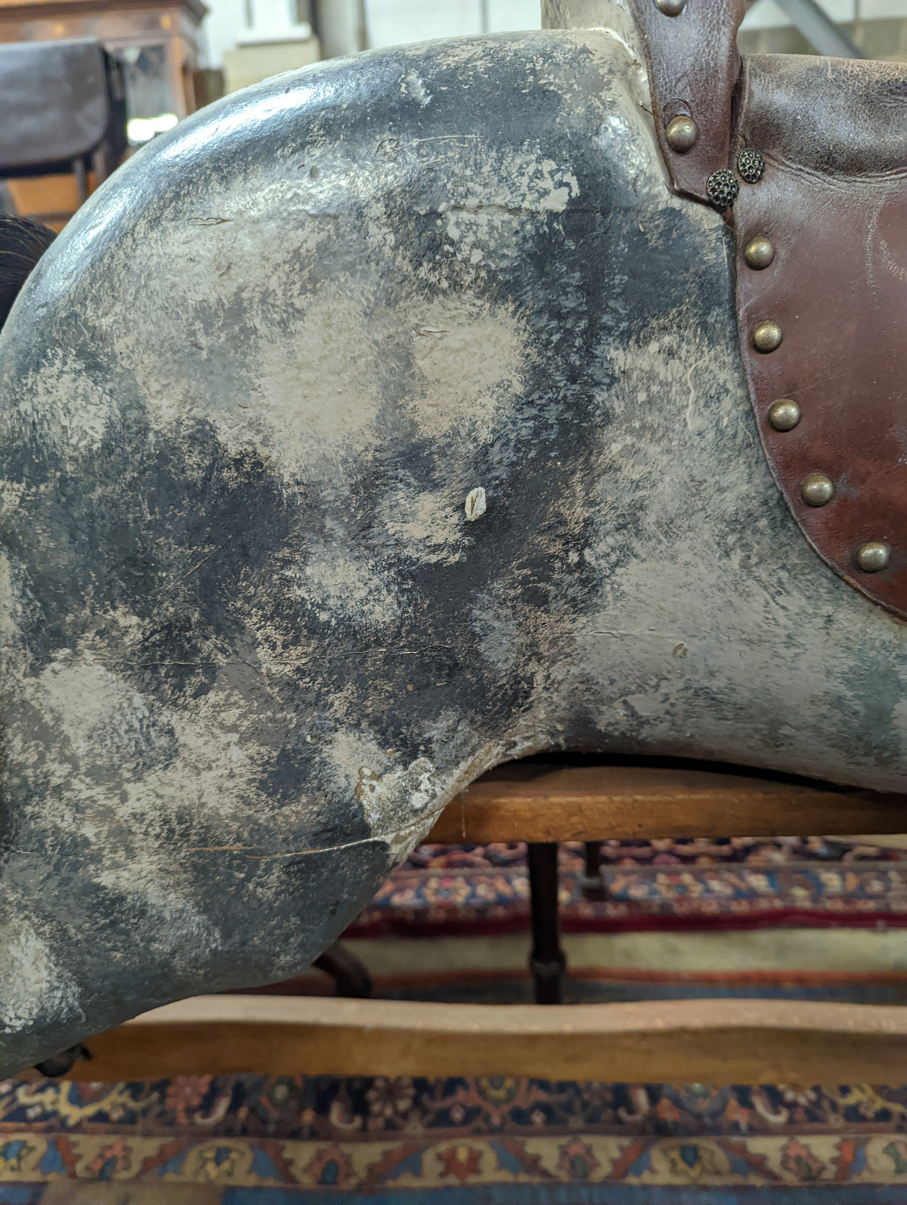 A large Edwardian Ayres type rocking horse on a turned safety frame, length 160cm, height 110cm